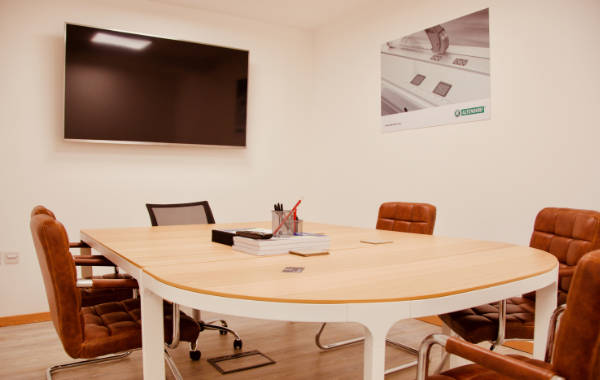 A photograph of R&J Machinery's meeting room