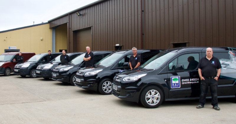 A photograph of the R&J Machinery engineering team alongside their vans